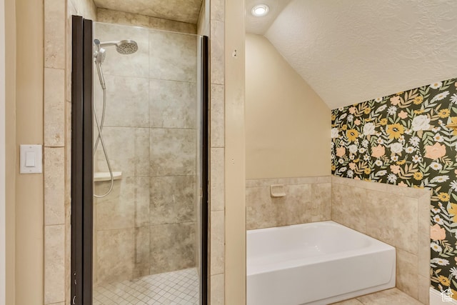 338 S Holdaway Rd, Vineyard, UT 84059 - bathroom featuring wallpapered walls, a garden tub, a stall shower, vaulted ceiling, and a textured ceiling