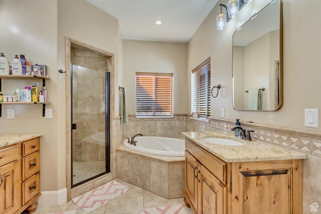 338 S Holdaway Rd, Vineyard, UT 84059 - bathroom with vanity, a bath, a shower stall, and tile patterned floors