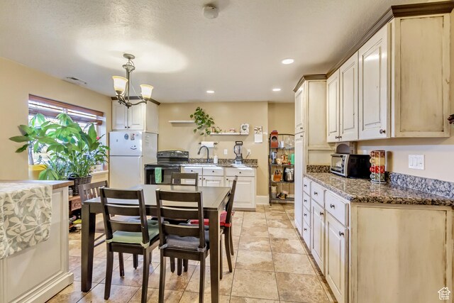 338 S Holdaway Rd, Vineyard, UT 84059 - dining space with a chandelier and recessed lighting