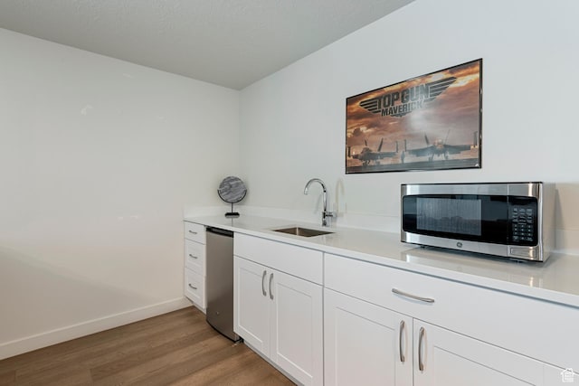 6691 Woods Rose Dr Unit 45, Park City, UT 84098 - bar featuring stainless steel microwave and light wood-style flooring