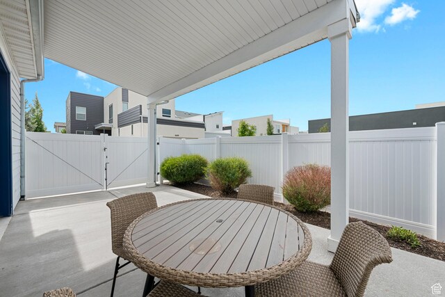 6691 Woods Rose Dr Unit 45, Park City, UT 84098 - view of patio / terrace with a gate and outdoor dining area