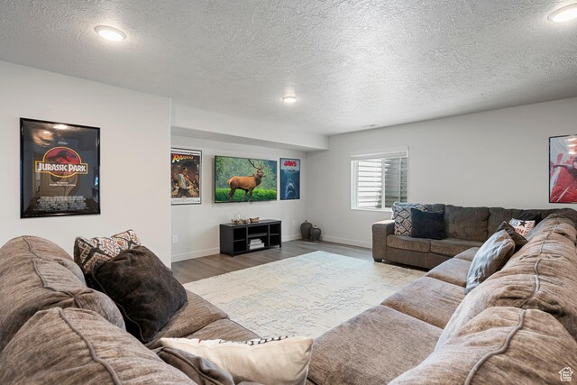 6691 Woods Rose Dr Unit 45, Park City, UT 84098 - living room featuring a textured ceiling, wood finished floors, and recessed lighting
