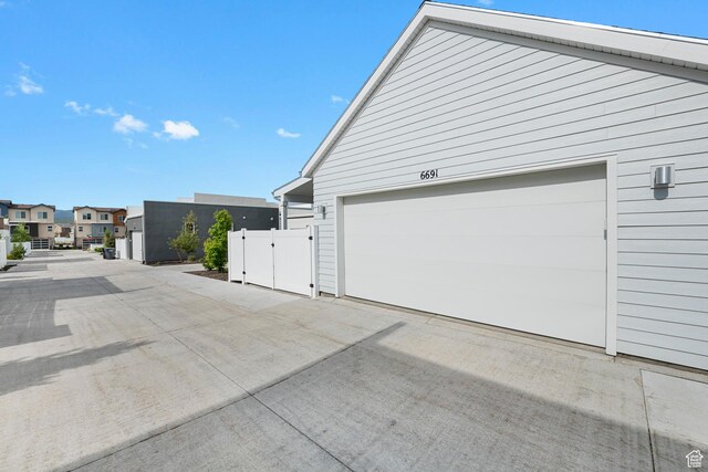 6691 Woods Rose Dr Unit 45, Park City, UT 84098 - garage featuring a residential view and concrete driveway