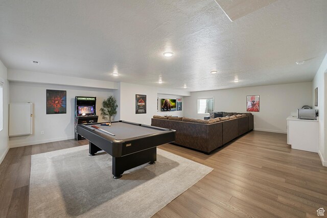 6691 Woods Rose Dr Unit 45, Park City, UT 84098 - playroom featuring billiards, light wood finished floors, and a textured ceiling