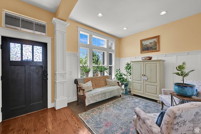 514 Rigby Rd, Farmington, UT 84025 - living room with a decorative wall, ornate columns, wainscoting, wood finished floors, and recessed lighting