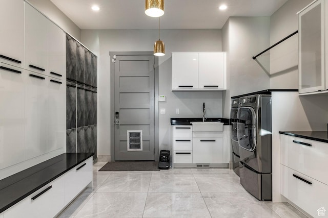 1621 E Box Elder Cir, Alpine, UT 84004 - laundry room with cabinet space, washer and clothes dryer, recessed lighting, and light marble finish floors