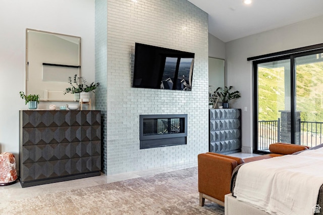 1621 E Box Elder Cir, Alpine, UT 84004 - bedroom with a glass covered fireplace, access to outside, vaulted ceiling, and tile patterned floors