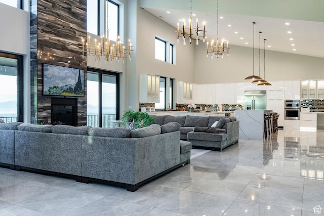 1621 E Box Elder Cir, Alpine, UT 84004 - living room with a chandelier, recessed lighting, high vaulted ceiling, light marble finish flooring, and a high end fireplace
