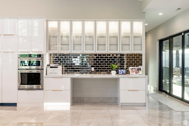 1621 E Box Elder Cir, Alpine, UT 84004 - kitchen with stainless steel double oven, white cabinets, backsplash, modern cabinets, and recessed lighting