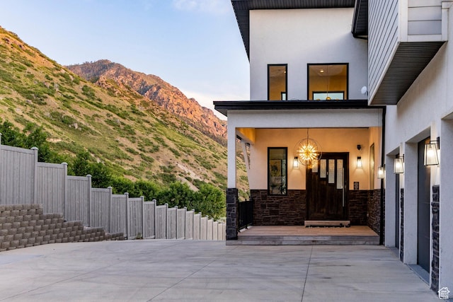 1621 E Box Elder Cir, Alpine, UT 84004 - property entrance featuring stucco siding, stone siding, and a mountain view