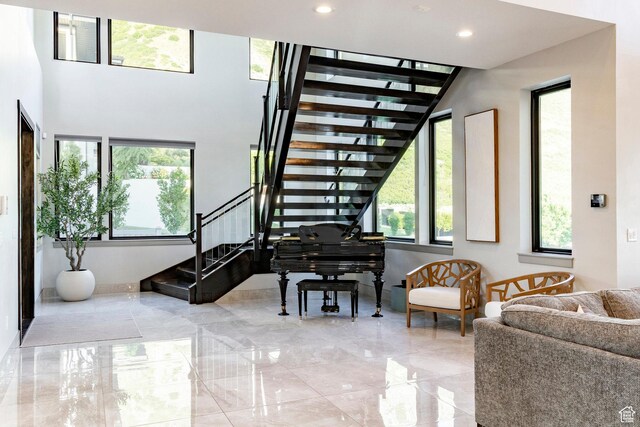 1621 E Box Elder Cir, Alpine, UT 84004 - stairs featuring marble tiled flooring, recessed lighting, and a towering ceiling