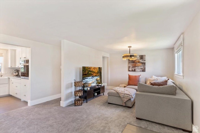 1393 E Davis Ave, Logan, UT 84321 - living room with light carpet and a chandelier