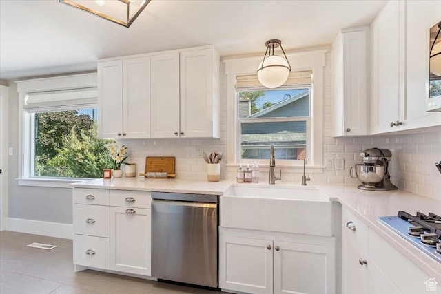 1393 E Davis Ave, Logan, UT 84321 - kitchen featuring stainless steel appliances, tasteful backsplash, plenty of natural light, and white cabinetry