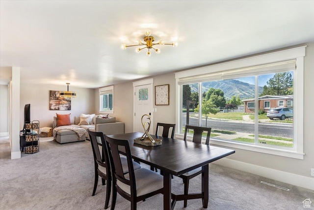 1393 E Davis Ave, Logan, UT 84321 - dining space with a chandelier, healthy amount of natural light, carpet floors, and a mountain view