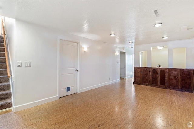1393 E Davis Ave, Logan, UT 84321 - unfurnished living room featuring stairway and light wood-style flooring