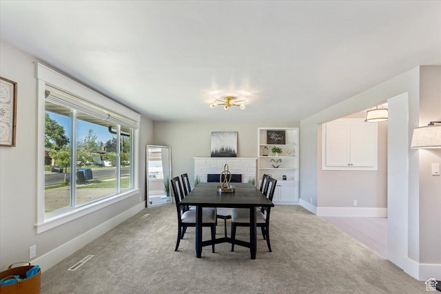 1393 E Davis Ave, Logan, UT 84321 - dining area featuring light carpet and built in shelves