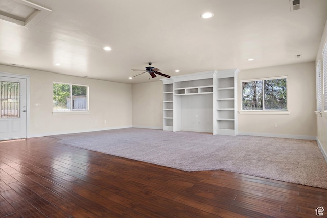 9096 N Canyon Rd, Cedar Hills, UT 84062 - unfurnished living room featuring healthy amount of natural light, a ceiling fan, recessed lighting, and wood-type flooring