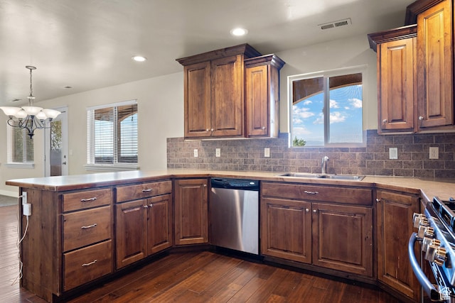 9096 N Canyon Rd, Cedar Hills, UT 84062 - kitchen with stainless steel appliances, a peninsula, a chandelier, dark wood-type flooring, and light countertops