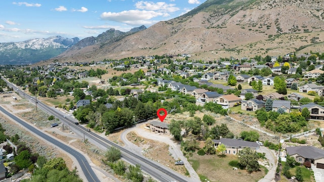 9096 N Canyon Rd, Cedar Hills, UT 84062 - aerial view of property and surrounding area featuring a mountain backdrop and nearby suburban area
