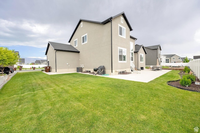 4655 N Ibapah St, Eagle Mountain, UT 84005 - rear view of house with a patio, stucco siding, and a residential view
