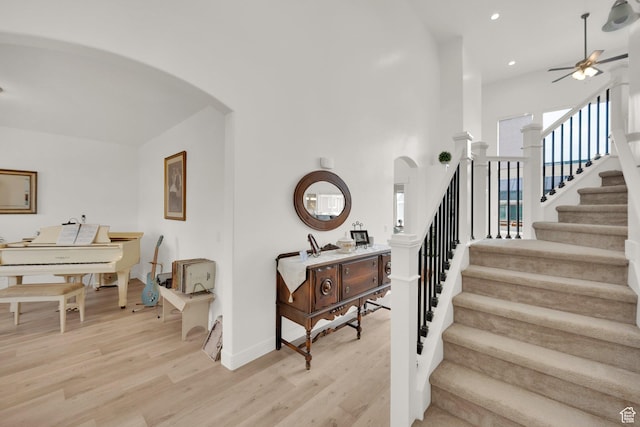 4655 N Ibapah St, Eagle Mountain, UT 84005 - stairs featuring arched walkways, ceiling fan, wood finished floors, and recessed lighting
