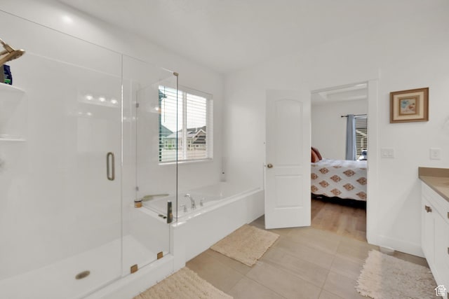 4655 N Ibapah St, Eagle Mountain, UT 84005 - full bathroom with a bath, vanity, a stall shower, tile patterned flooring, and ensuite bath