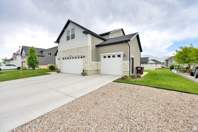 4655 N Ibapah St, Eagle Mountain, UT 84005 - view of side of home featuring stone siding, board and batten siding, driveway, and an attached garage