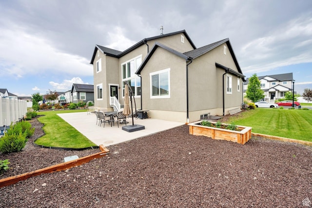 4655 N Ibapah St, Eagle Mountain, UT 84005 - back of house with a patio area, a residential view, and stucco siding