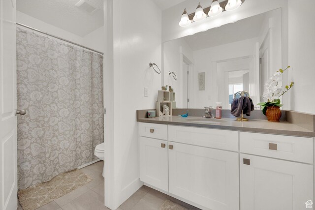 4655 N Ibapah St, Eagle Mountain, UT 84005 - full bathroom with vanity, tile patterned floors, and a shower with shower curtain
