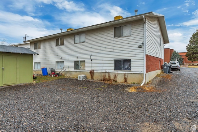 41 S 200 E, Santaquin, UT 84655 - rear view of property featuring a storage unit and a chimney