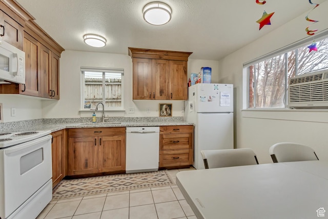 41 S 200 E, Santaquin, UT 84655 - kitchen with white appliances, brown cabinets, cooling unit, light stone counters, and light tile patterned flooring
