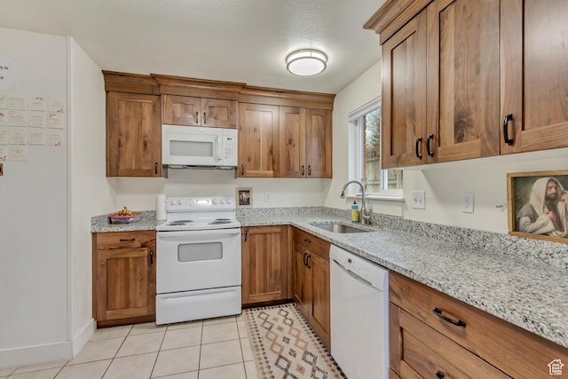 41 S 200 E, Santaquin, UT 84655 - kitchen with white appliances, brown cabinets, and light stone countertops