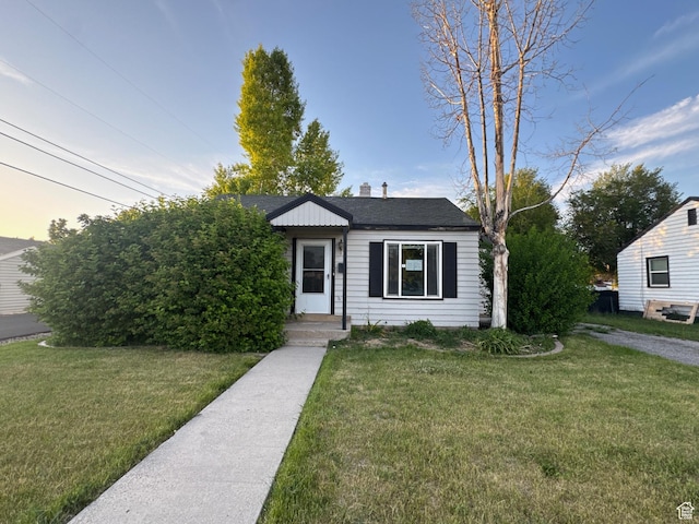 1704 W 50 N, Provo, UT 84601 - view of front of house featuring a front lawn, a shingled roof, and a chimney