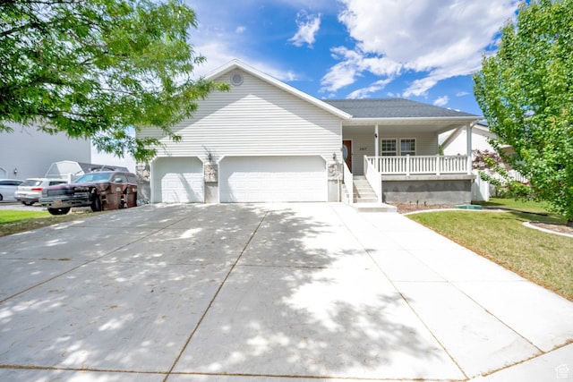 2017 E Lodge Pole Dr, Eagle Mountain, UT 84005 - ranch-style home featuring covered porch, a garage, concrete driveway, and a front lawn