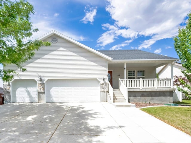 2017 E Lodge Pole Dr, Eagle Mountain, UT 84005 - ranch-style home featuring concrete driveway, a porch, and a garage