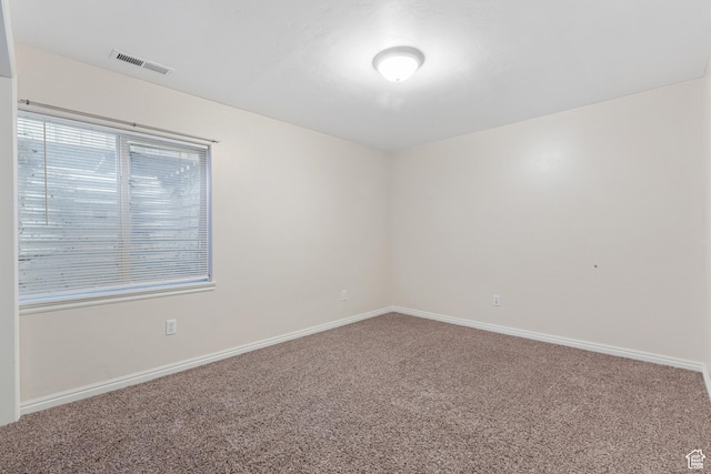 7114 N Ute Dr Unit 70, Eagle Mountain, UT 84005 - empty room with carpet and baseboards