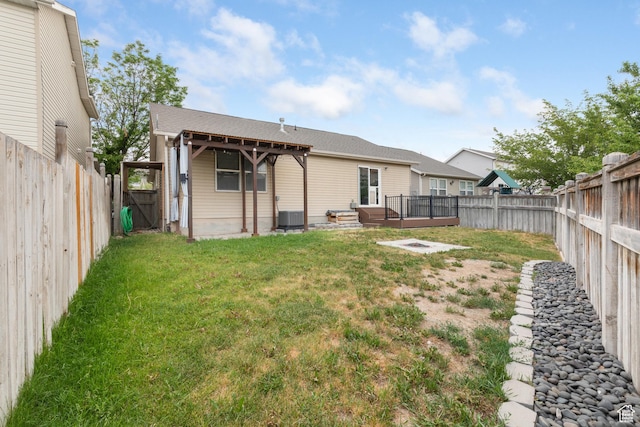 7114 N Ute Dr Unit 70, Eagle Mountain, UT 84005 - back of property featuring a fenced backyard, a deck, and a gate