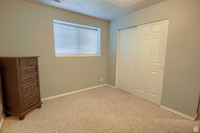 1657 N Lewis And Clark Dr, Centerville, UT 84014 - unfurnished bedroom with light carpet, a closet, and a textured ceiling