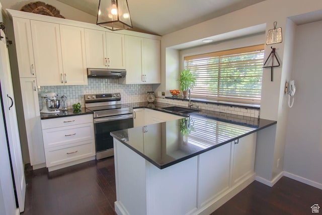 1657 N Lewis And Clark Dr, Centerville, UT 84014 - kitchen with stainless steel range with electric stovetop, under cabinet range hood, dark countertops, dark wood finished floors, and lofted ceiling