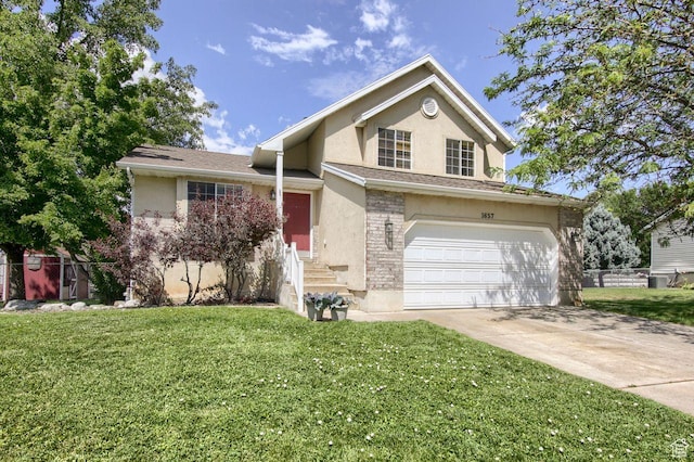 1657 N Lewis And Clark Dr, Centerville, UT 84014 - view of front of house featuring stucco siding, concrete driveway, and a garage