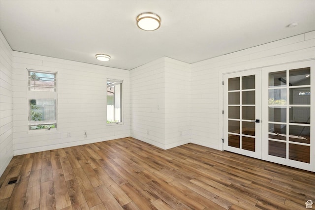 1520 N 1600 E, North Logan, UT 84341 - empty room featuring french doors, wood-type flooring, and wooden walls