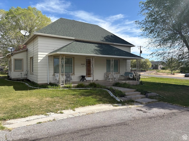 279 E 50 N, Moroni, UT 84646 - view of front of property with a shingled roof, a porch, and a front yard