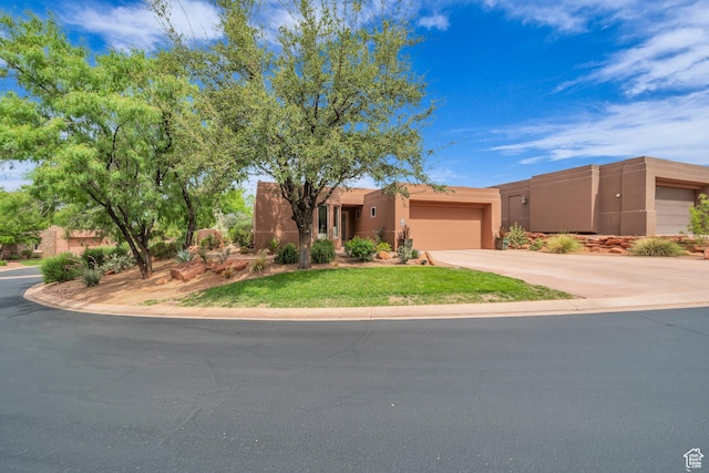 2255 Tuweap Dr N Unit 54, St George, UT 84770 - southwest-style home featuring an attached garage, concrete driveway, stucco siding, and a front yard