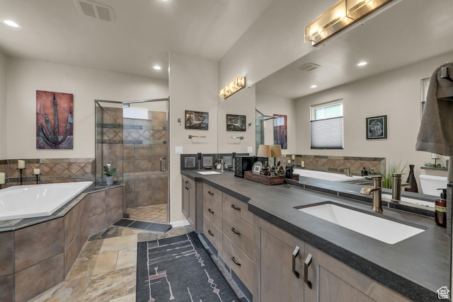 2255 Tuweap Dr N Unit 54, St George, UT 84770 - full bathroom with double vanity, a stall shower, a garden tub, and recessed lighting