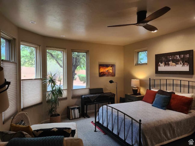 2255 Tuweap Dr N Unit 54, St George, UT 84770 - bedroom featuring carpet, multiple windows, ceiling fan, and recessed lighting