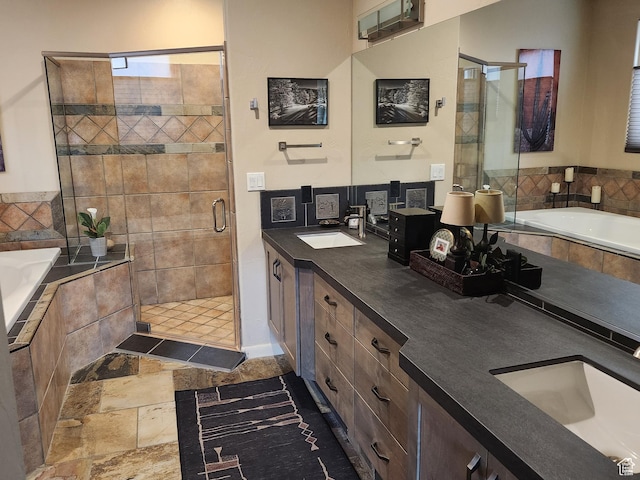 2255 Tuweap Dr N Unit 54, St George, UT 84770 - bathroom with double vanity, a shower stall, a garden tub, and stone finish flooring