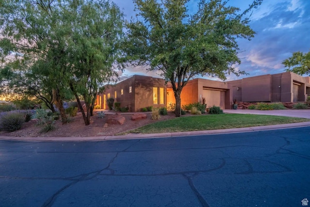 2255 Tuweap Dr N Unit 54, St George, UT 84770 - pueblo revival-style home with a garage, concrete driveway, and stucco siding