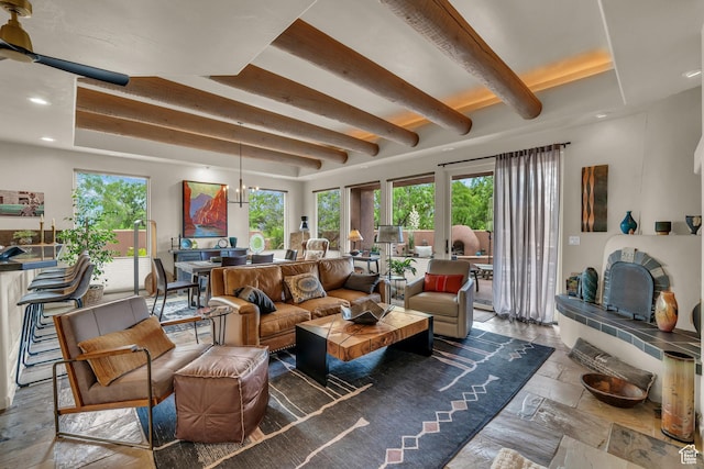 2255 Tuweap Dr N Unit 54, St George, UT 84770 - living room with healthy amount of natural light, beam ceiling, recessed lighting, and stone tile floors