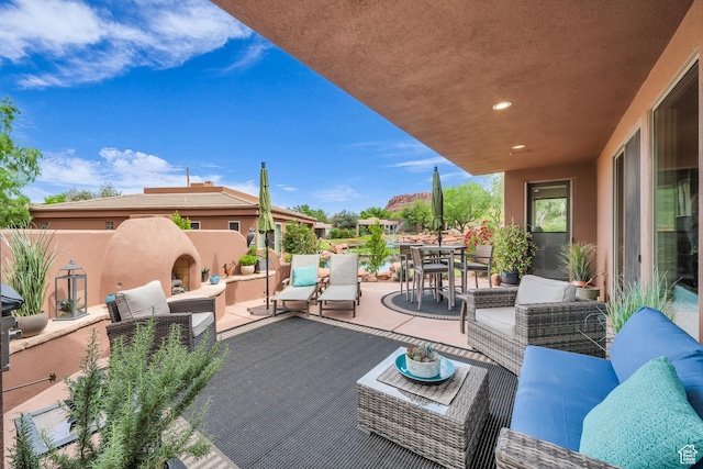 2255 Tuweap Dr N Unit 54, St George, UT 84770 - view of patio with outdoor lounge area and outdoor dining space