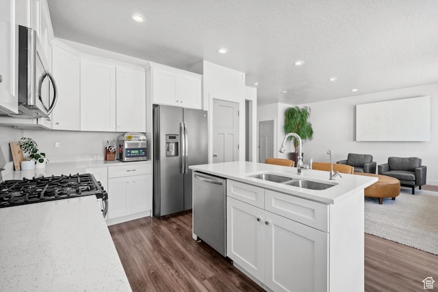 3712 E Long Ridge Dr Unit 124, Eagle Mountain, UT 84005 - kitchen with appliances with stainless steel finishes, dark wood-style floors, open floor plan, recessed lighting, and white cabinets